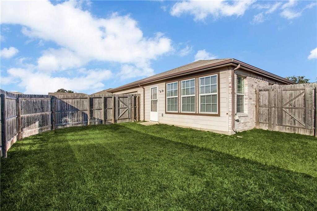 14816 South Spring Ridge Circle Balch Springs, TX 75180 - Photo 11 of 11 a front view of a house with a garden