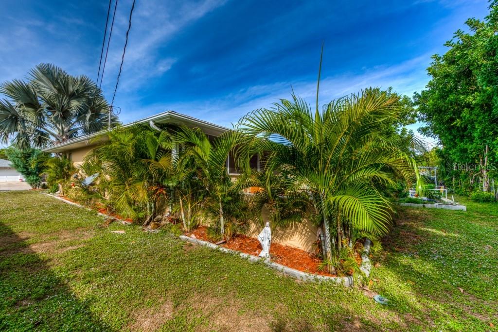 1453 Nantucket Road Venice, FL 34293 - Photo 23 of 35 Luscious tropical landscaping add beauty and privacy.
