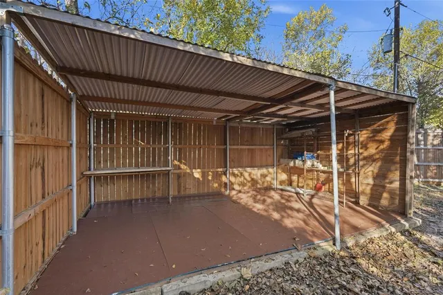 a view of a patio with table and chairs