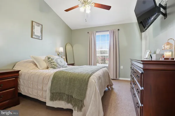 a bed room with a bed and a window