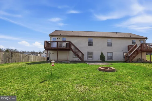 a house with swimming pool in front of it