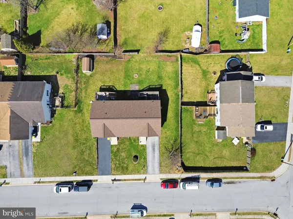 an aerial view of a house with a swimming pool