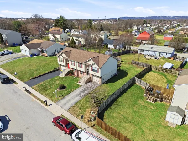 an aerial view of a house with a garden
