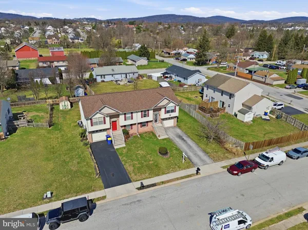 an aerial view of residential houses with outdoor space