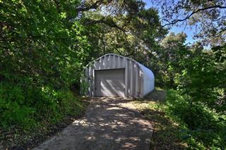 530 Payne Road San Juan Bautista, CA 95045 - Photo 20 of 21 a view of backyard with large trees and a barn