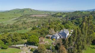 530 Payne Road San Juan Bautista, CA 95045 - Photo 21 of 21 a view of a lush green forest with trees and some houses