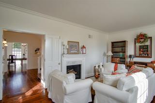 530 Payne Road San Juan Bautista, CA 95045 - Photo 8 of 21 a living room with furniture a fireplace and a wooden floor