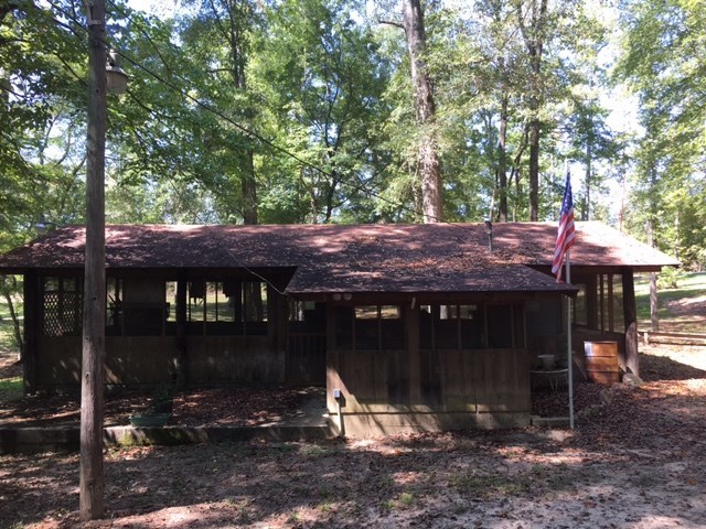 1031 Mt Paran Road Lizella, GA 31052 - Photo 11 of 23 a view of a table and chairs under an umbrella