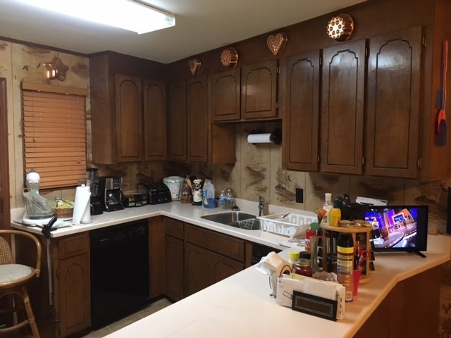 1031 Mt Paran Road Lizella, GA 31052 - Photo 16 of 23 a kitchen with sink refrigerator and cabinets