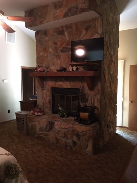 1031 Mt Paran Road Lizella, GA 31052 - Photo 19 of 23 a living room with furniture and a fireplace