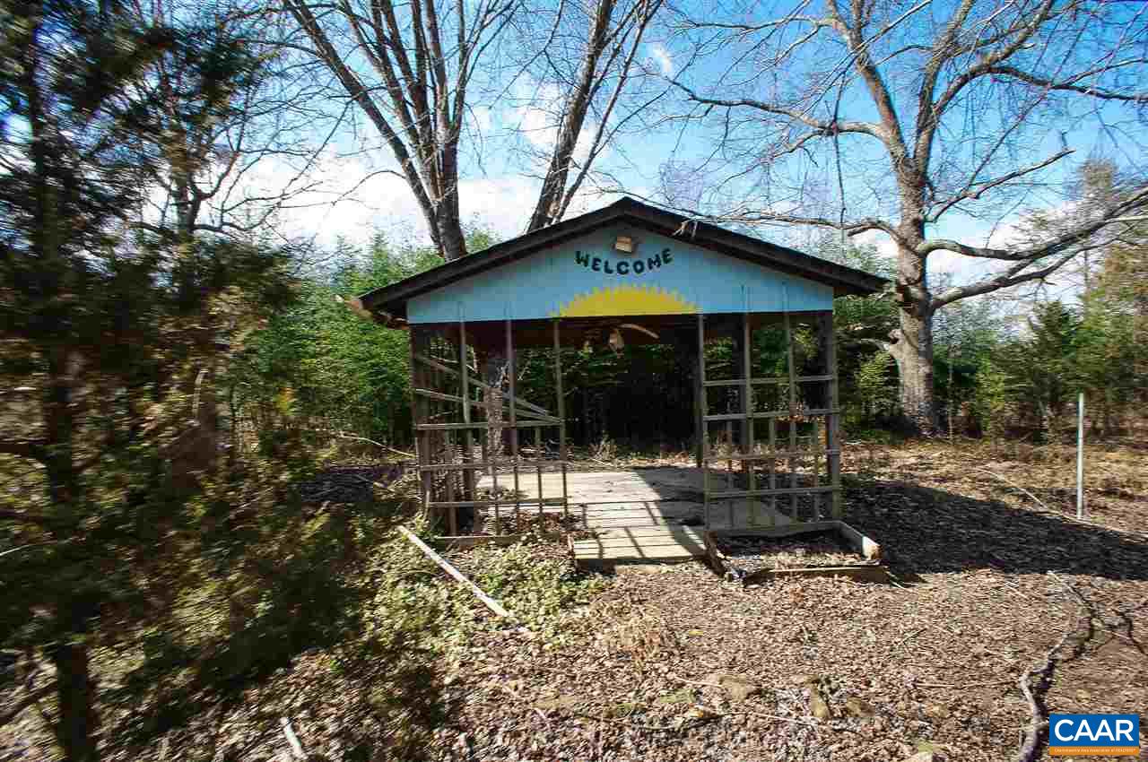 1475 Hunters Lodge Road Troy, VA 22974 - Photo 11 of 12 a view of a house with backyard and chairs