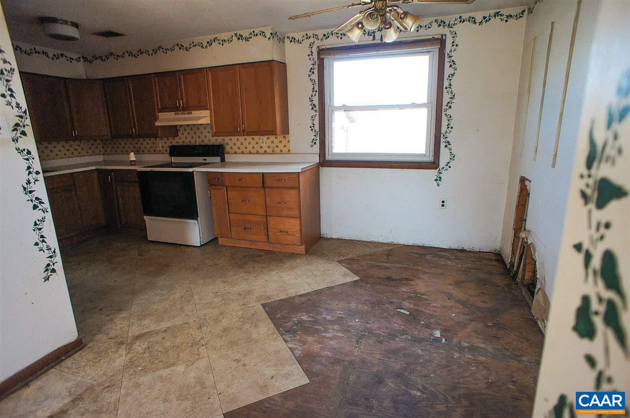 1475 Hunters Lodge Road Troy, VA 22974 - Photo 4 of 12 a kitchen with a stove a sink and a microwave