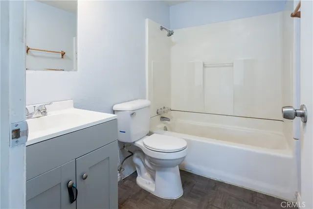 a bathroom with a sink toilet and bathtub