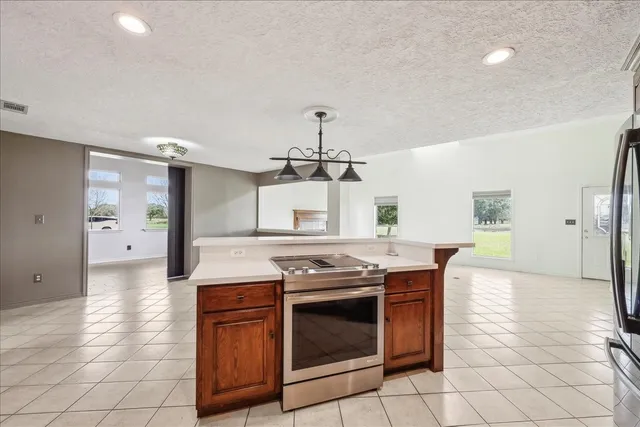 a kitchen with a stove and a sink