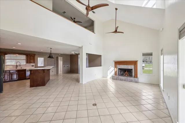 a view of a kitchen and an empty room