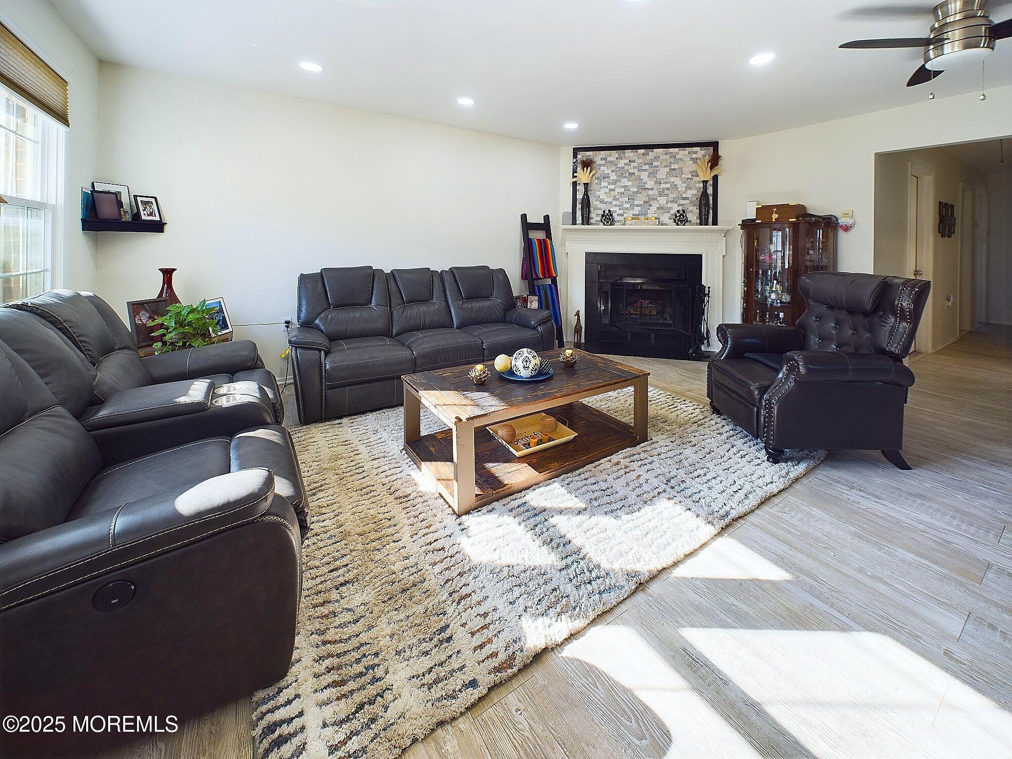 24 B Medford Road Whiting, NJ 08759 - Photo 14 of 42 a living room with furniture a fireplace and a flat screen tv