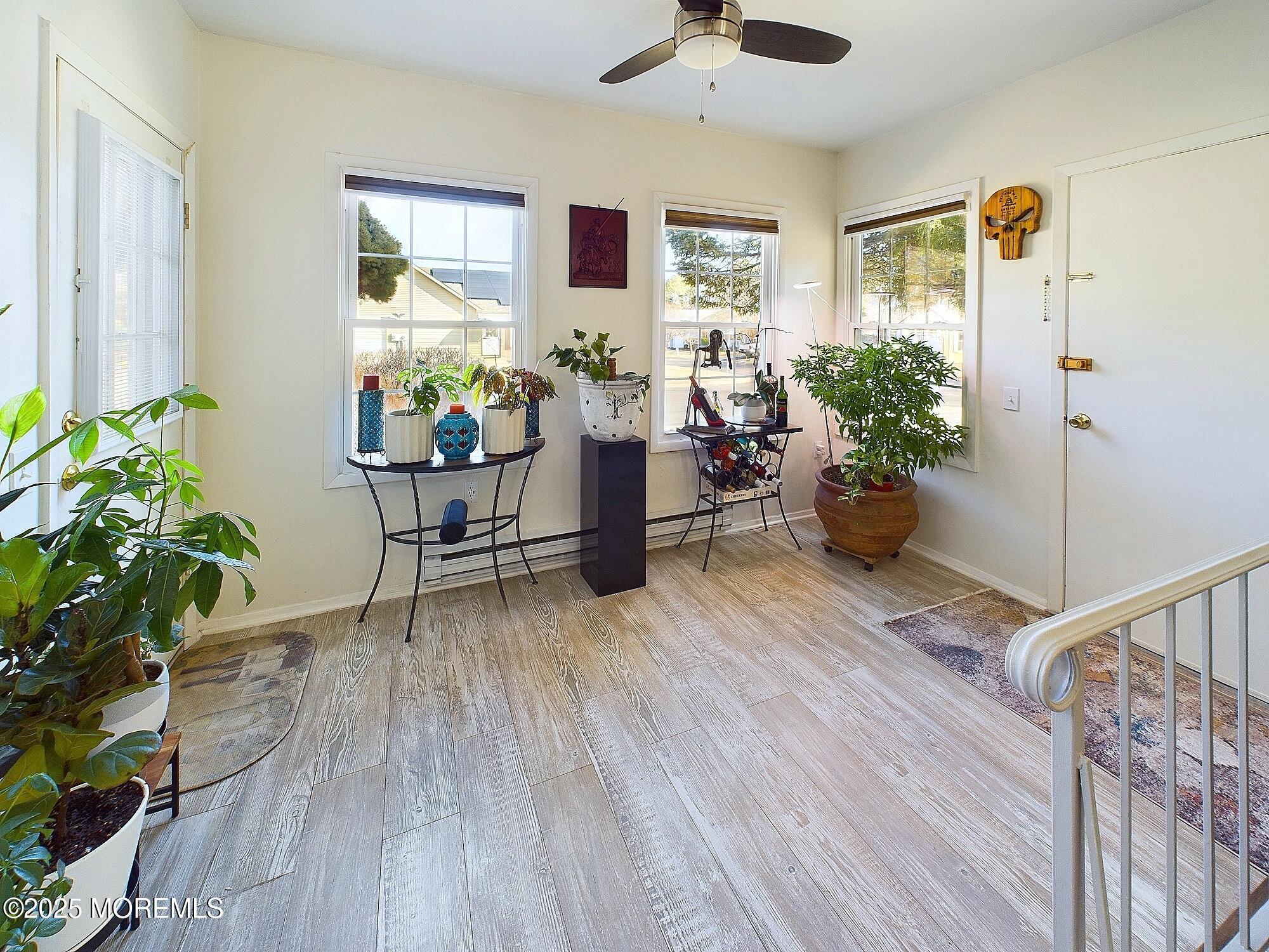 24 B Medford Road Whiting, NJ 08759 - Photo 21 of 42 a living room with furniture and a potted plant