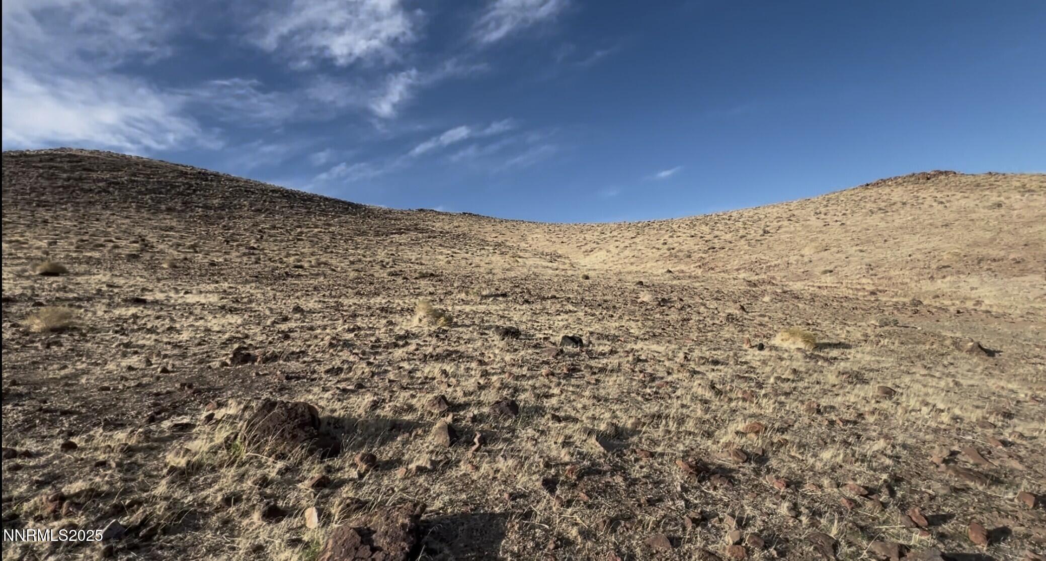 9325 Western Way Stagecoach, NV 89429 - Photo 2 of 11 a view of a large building with mountains in the background