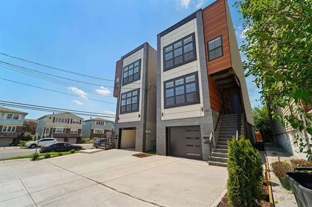 a couple of cars parked in front of building