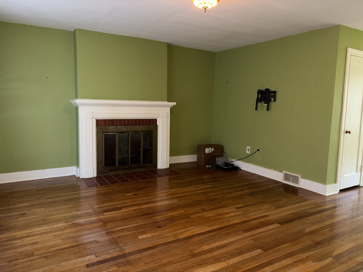 500 South Green Street Anna, IL 62906 - Photo 20 of 30 a view of a livingroom with wooden floor and a fireplace