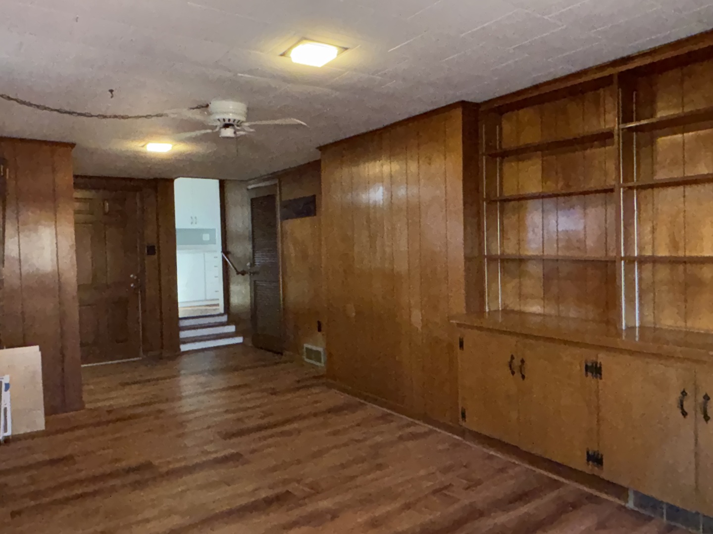 500 South Green Street Anna, IL 62906 - Photo 25 of 30 an empty room with wooden floor and cabinet