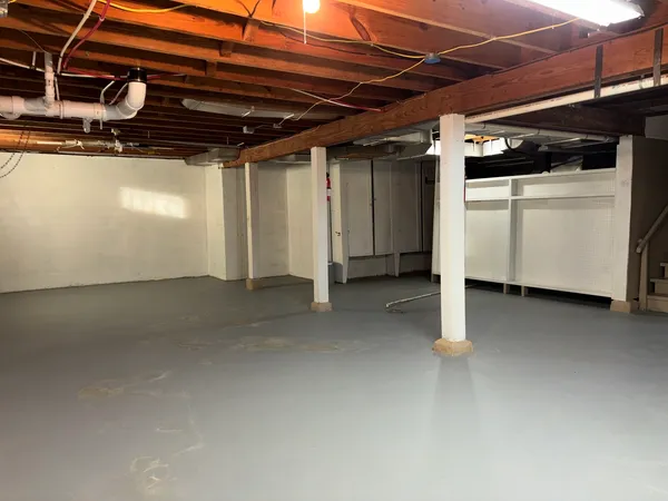 a view of empty room with wooden walls