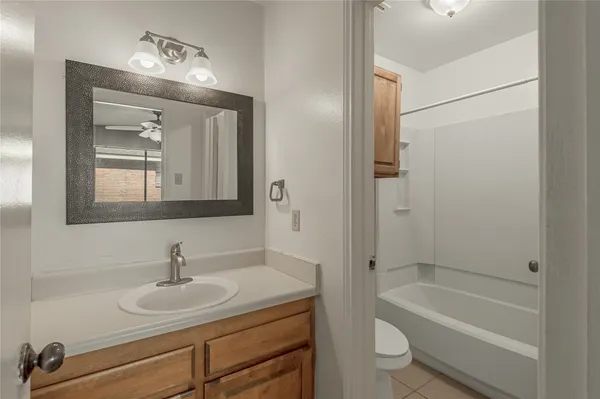 a bathroom with a sink toilet a vanity and shower