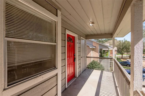a view of a balcony with a door