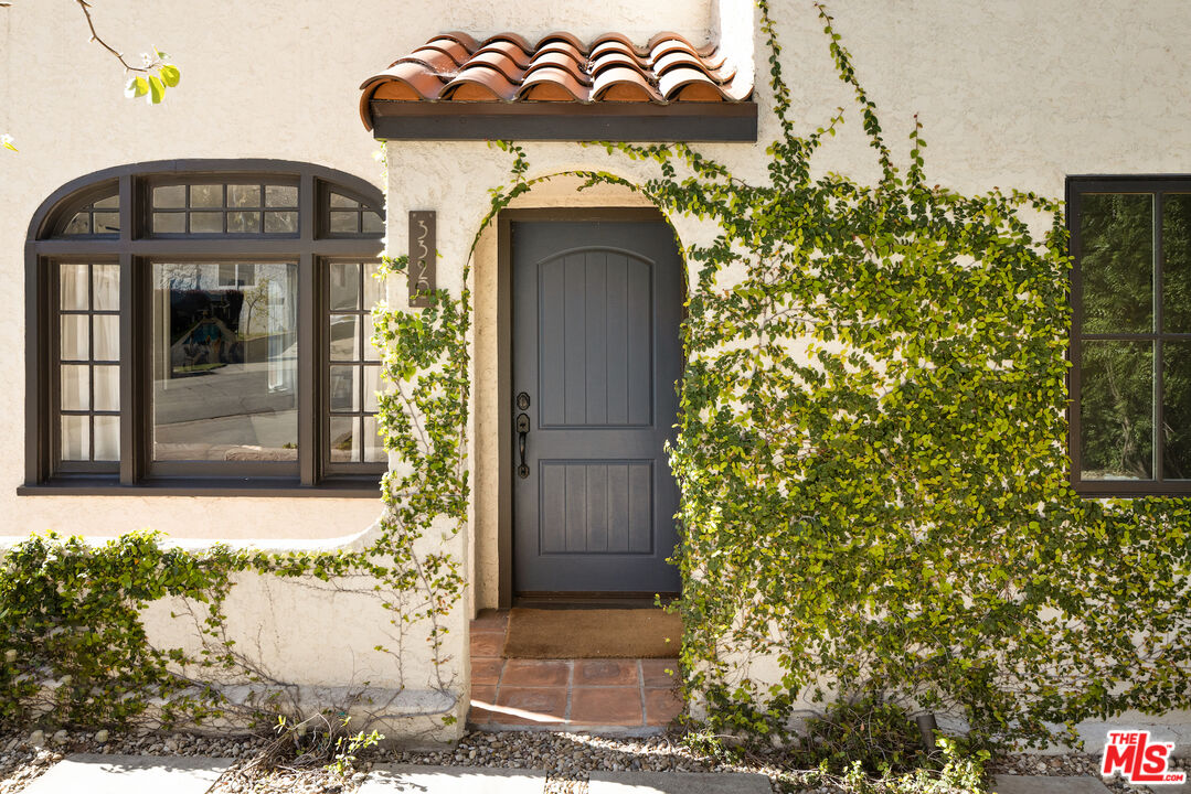 3320 Community Avenue Glendale, CA 91214 - Photo 1 of 32 a front view of a house with a yard