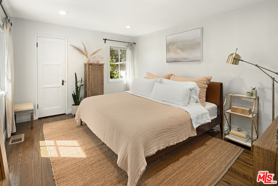 3320 Community Avenue Glendale, CA 91214 - Photo 14 of 32 a bedroom with a bed and a night stand