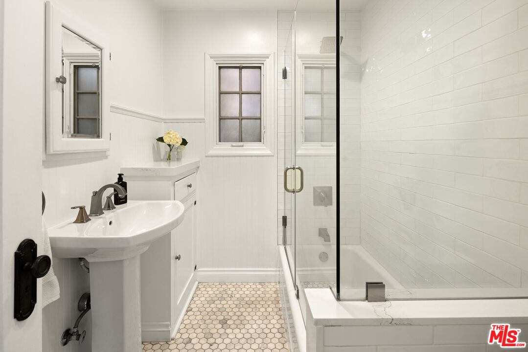 3320 Community Avenue Glendale, CA 91214 - Photo 15 of 32 a bathroom with a sink a toilet and shower