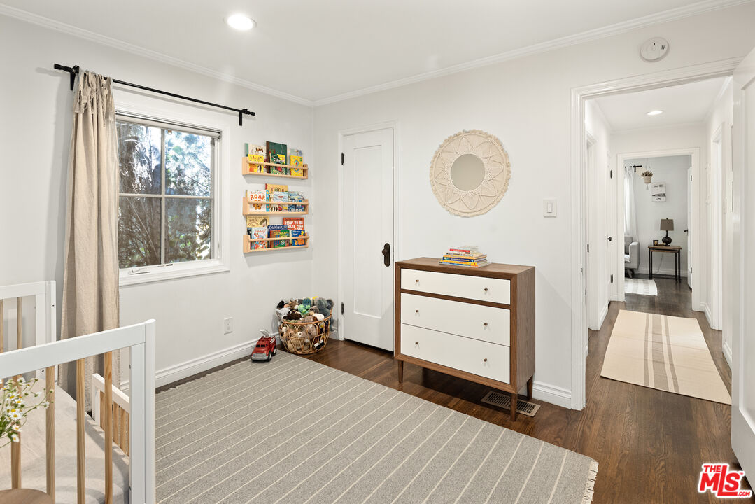 3320 Community Avenue Glendale, CA 91214 - Photo 17 of 32 a bedroom with a bed and a mirror