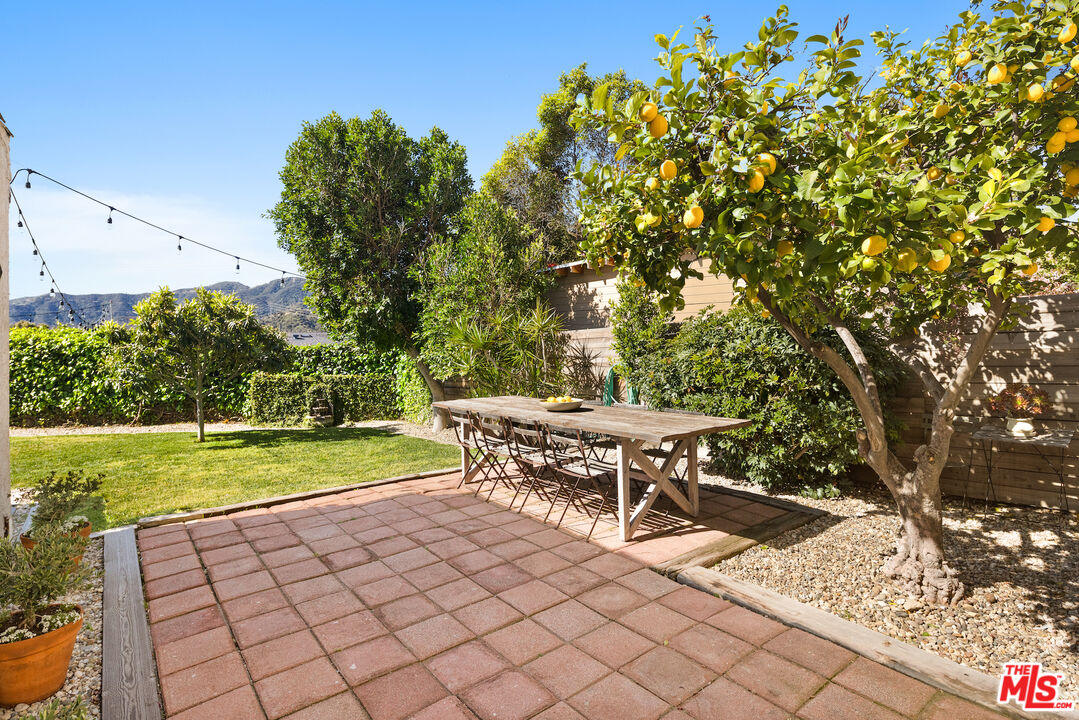 3320 Community Avenue Glendale, CA 91214 - Photo 23 of 32 a view of a yard with a table and a chair