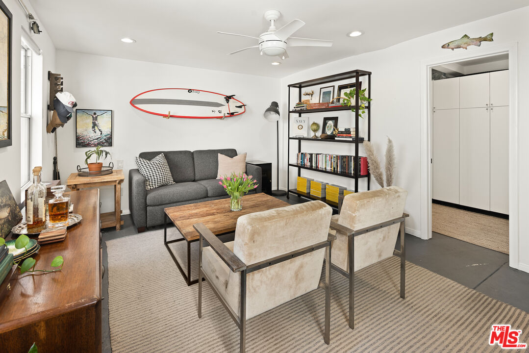 3320 Community Avenue Glendale, CA 91214 - Photo 26 of 32 a living room with furniture a rug and white walls