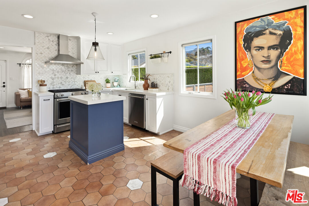 3320 Community Avenue Glendale, CA 91214 - Photo 8 of 32 a kitchen with stainless steel appliances granite countertop a sink a stove a refrigerator and cabinets