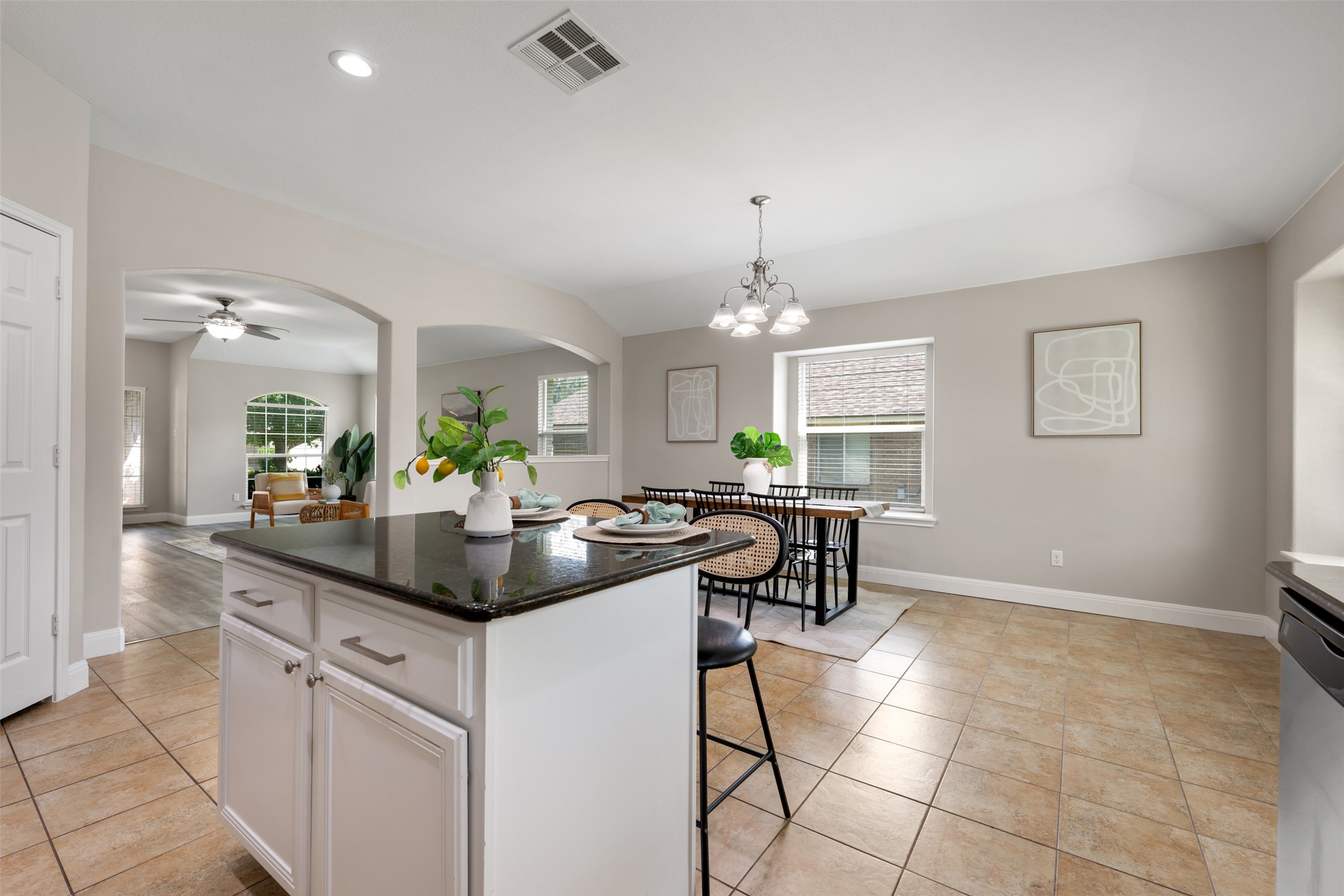 18820 Edinburgh Castle Road Pflugerville, TX 78660 - Photo 10 of 37 a kitchen with granite countertop a sink and chandelier