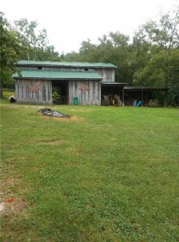 585 Ramsey Road Lebanon, TN 37087 - Photo 3 of 13 a front view of a house with a garden