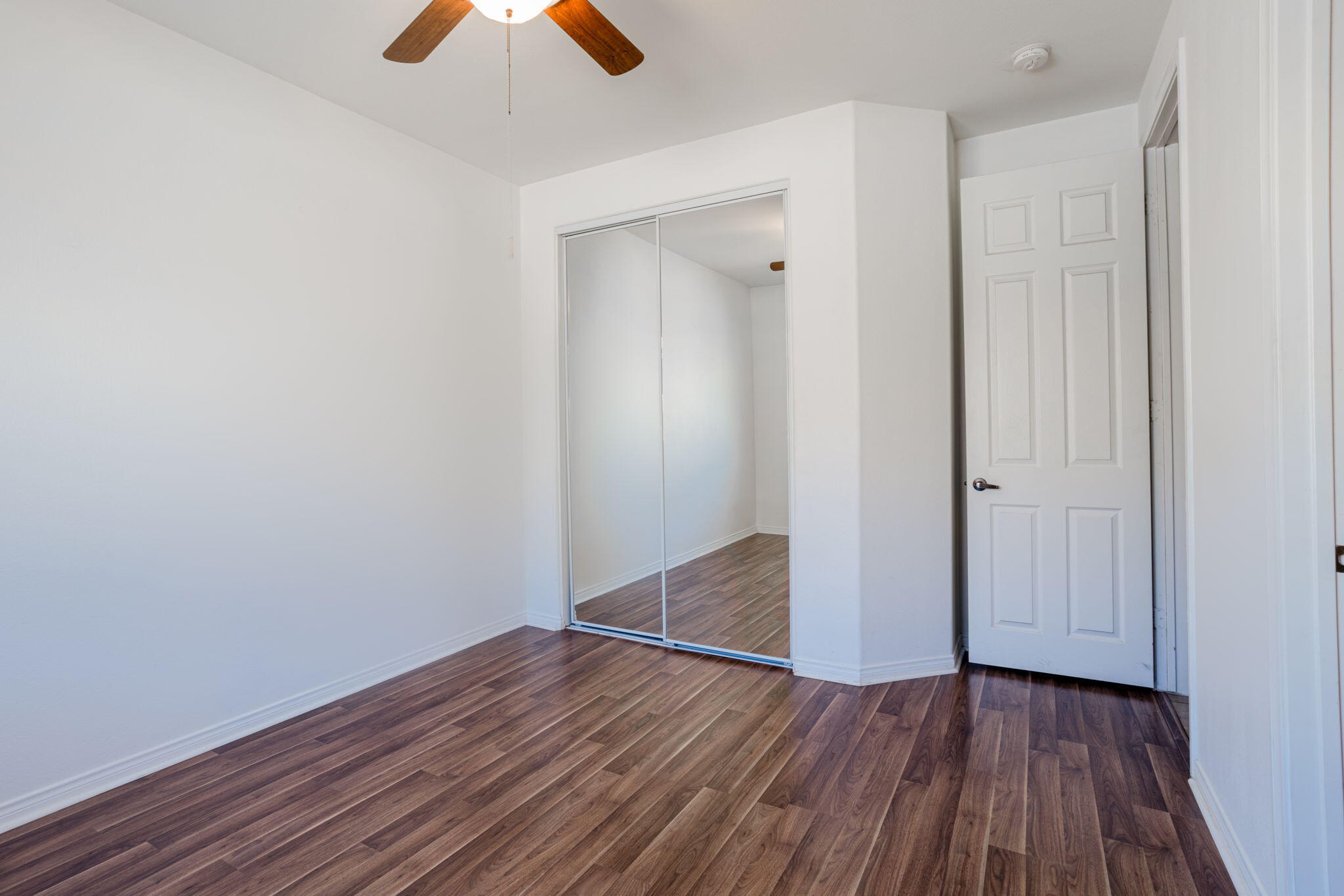 244 Via Padua Rancho Mirage, CA 92270 - Photo 15 of 30 a view of an empty room with wooden floor