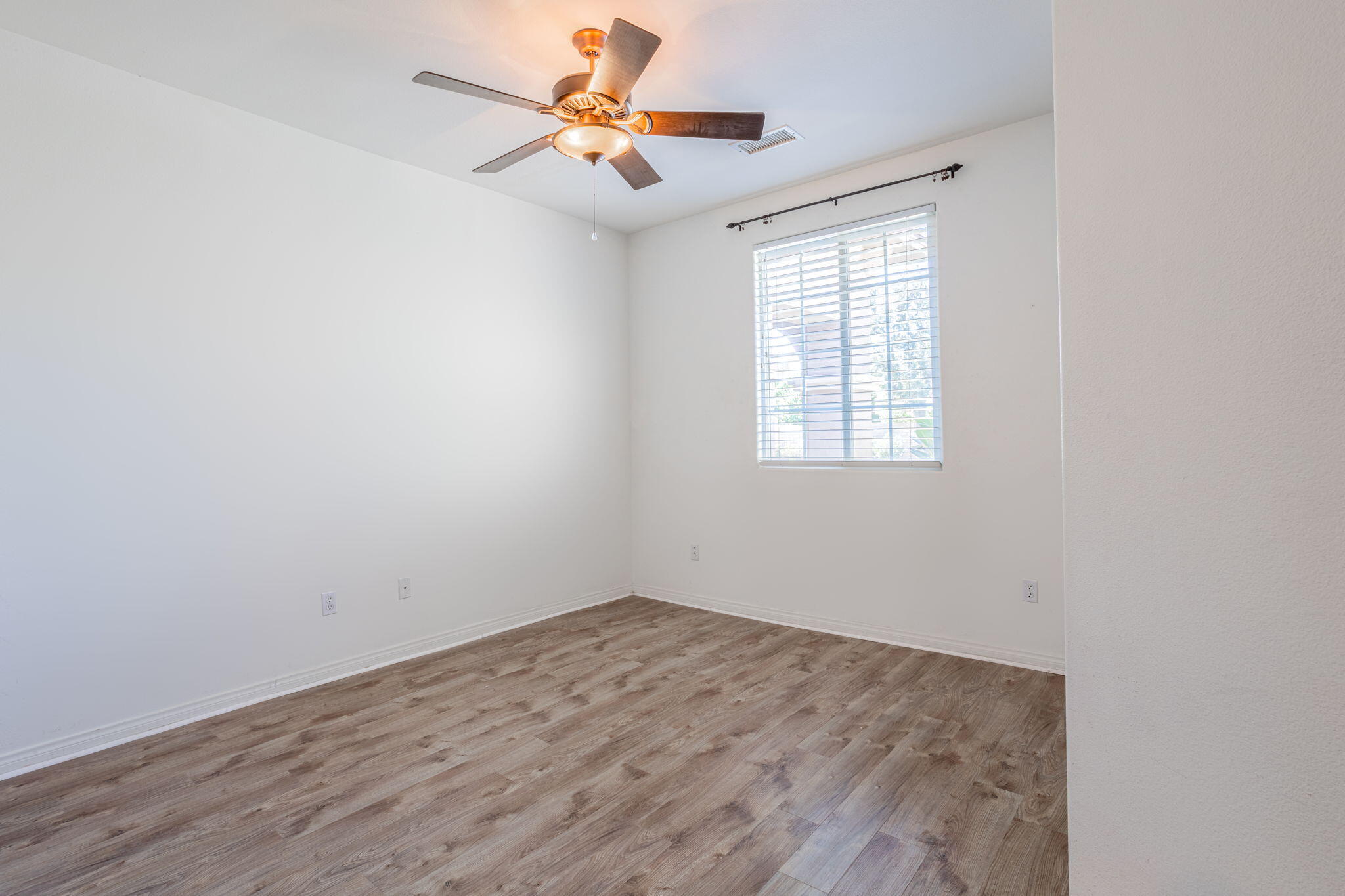 244 Via Padua Rancho Mirage, CA 92270 - Photo 20 of 30 an empty room with a window and a fan