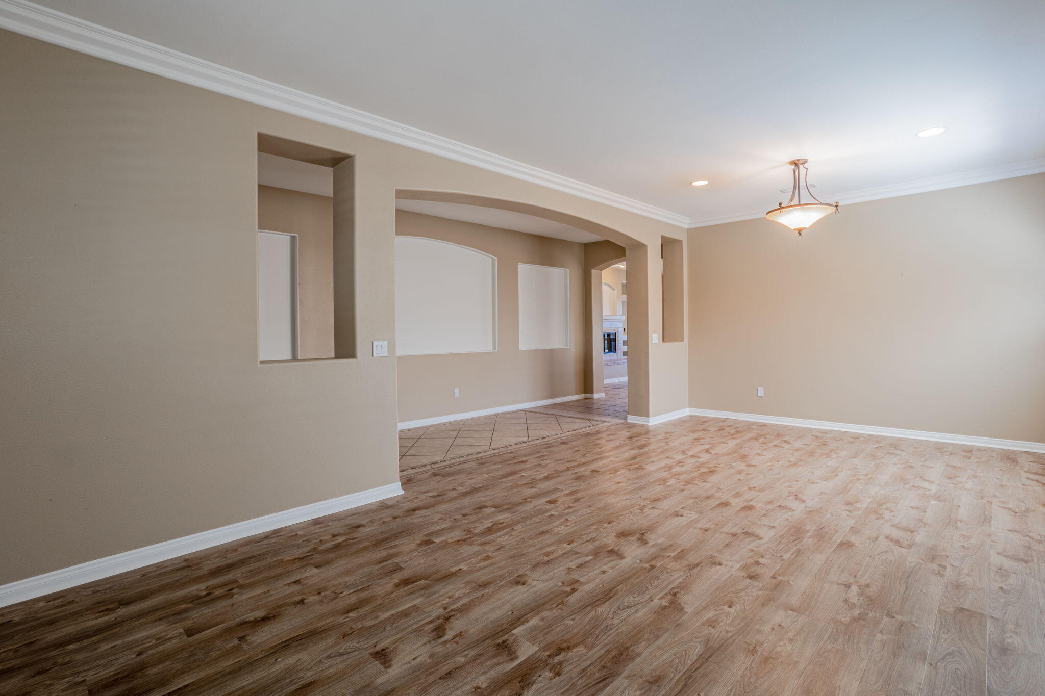 244 Via Padua Rancho Mirage, CA 92270 - Photo 3 of 30 a view of an empty room with wooden floor and a window