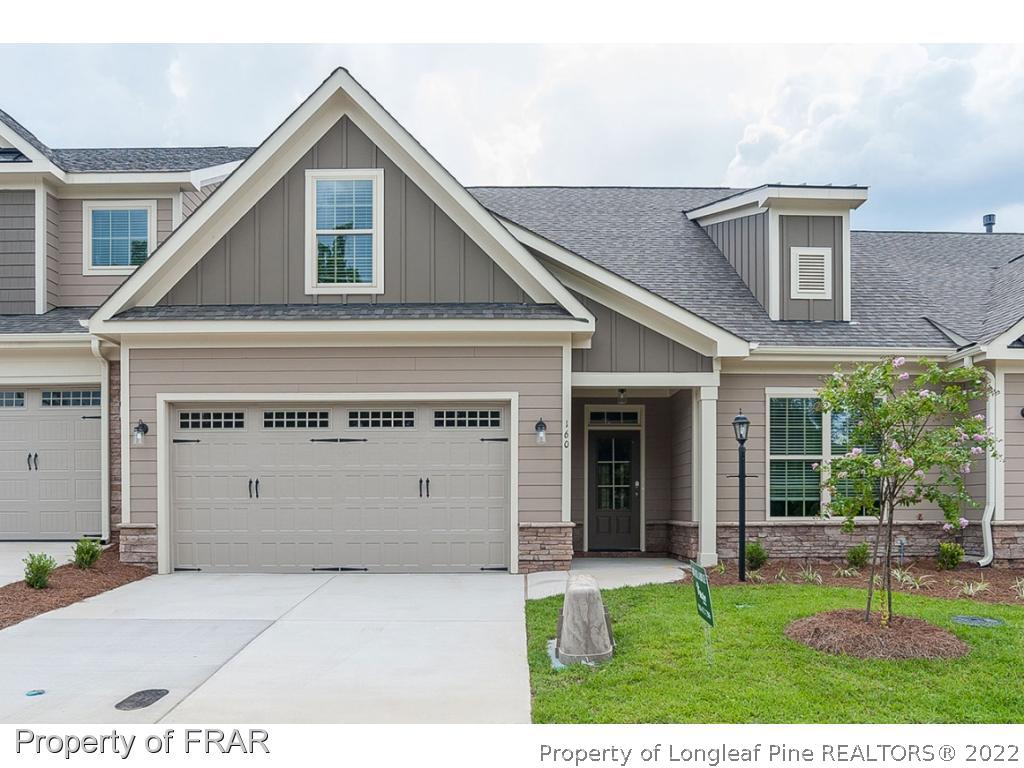 160 Winged Foot Road Pinehurst, NC 28374 - Photo 1 of 35 a view of an house with backyard space and balcony