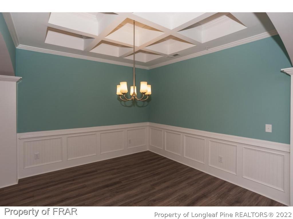 160 Winged Foot Road Pinehurst, NC 28374 - Photo 11 of 35 a view of a room with wooden floor cabinets and a window