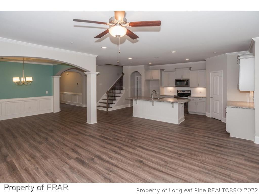 160 Winged Foot Road Pinehurst, NC 28374 - Photo 14 of 35 a view of kitchen with cabinets and wooden floor