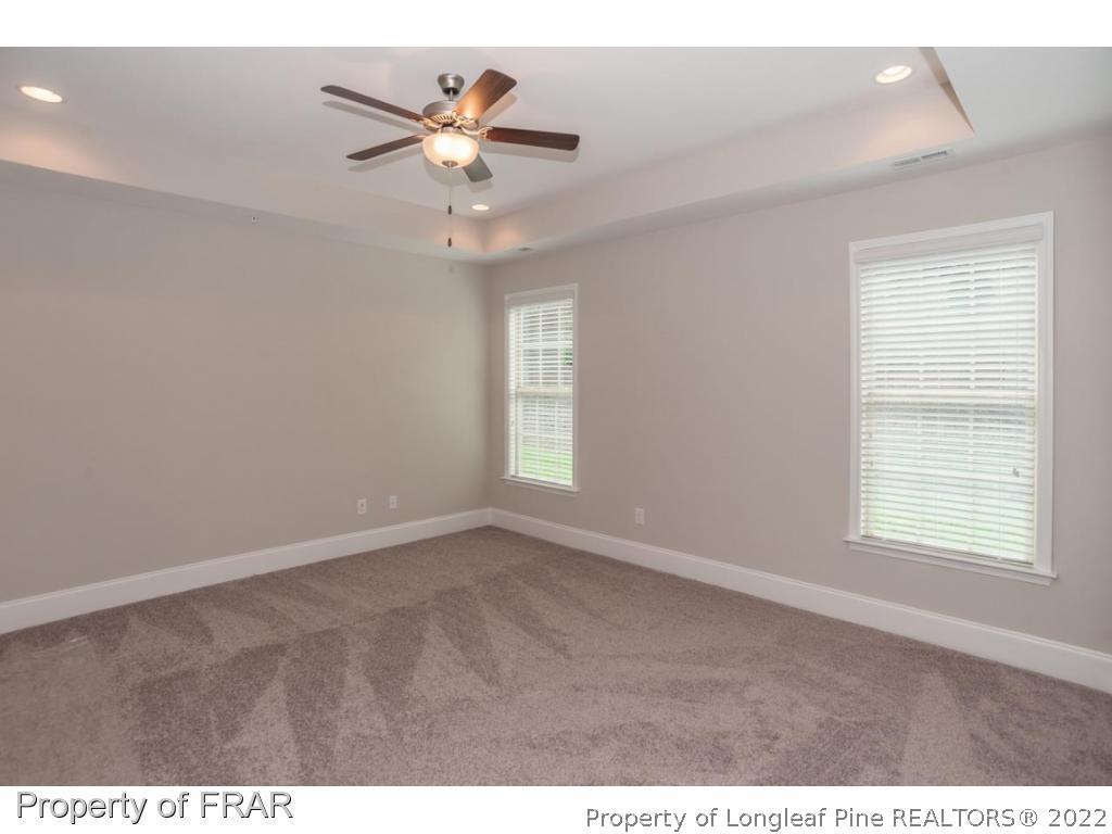 160 Winged Foot Road Pinehurst, NC 28374 - Photo 21 of 35 a view of an empty room with a window
