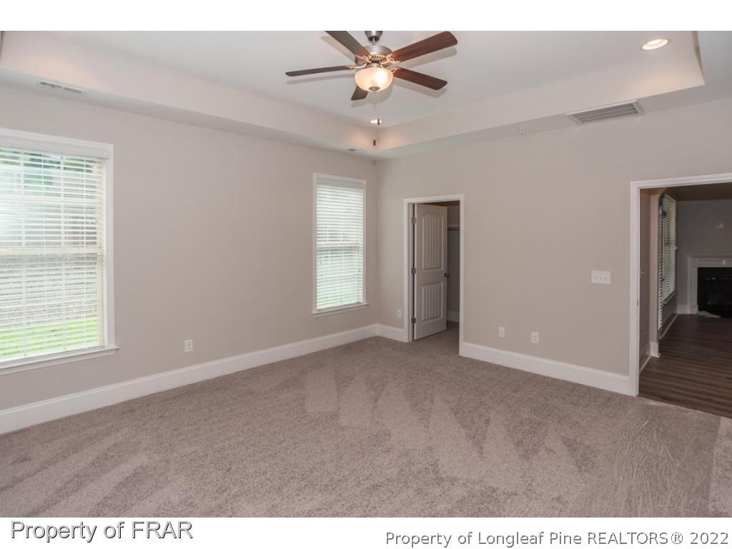 160 Winged Foot Road Pinehurst, NC 28374 - Photo 22 of 35 a view of an empty room with a window