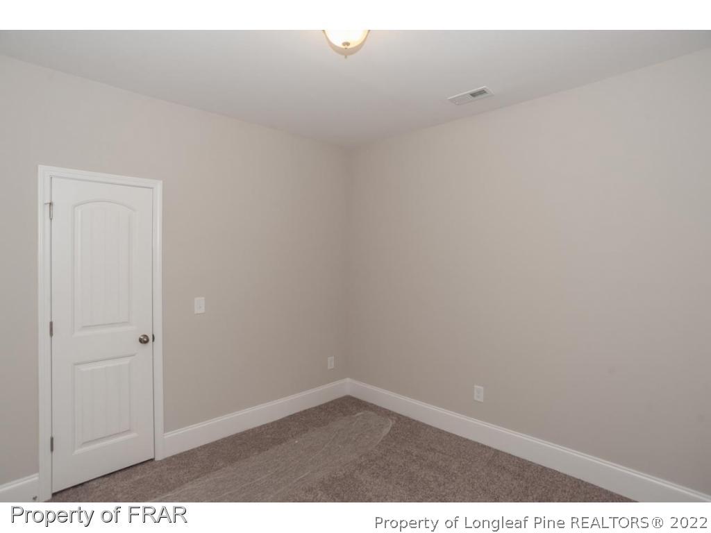 160 Winged Foot Road Pinehurst, NC 28374 - Photo 27 of 35 a view of an empty room