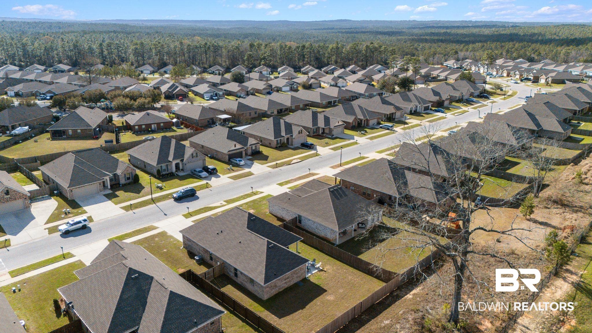10745 Brodick Loop Daphne, AL 36527 - Photo 33 of 39 Aerial perspective of suburban area featuring a heavily wooded area