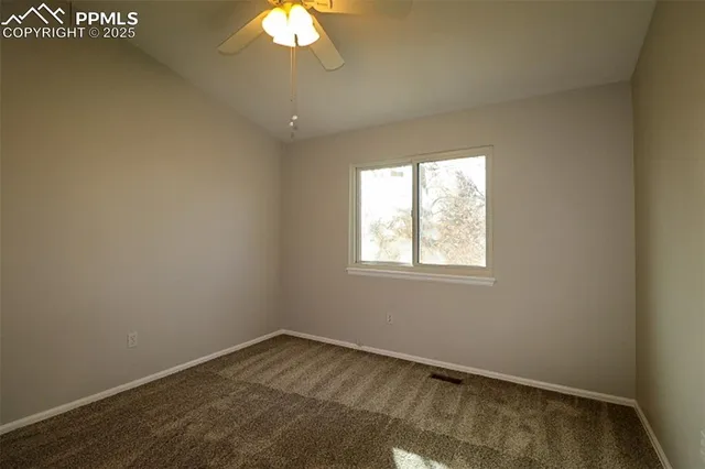 an empty room with a bathroom