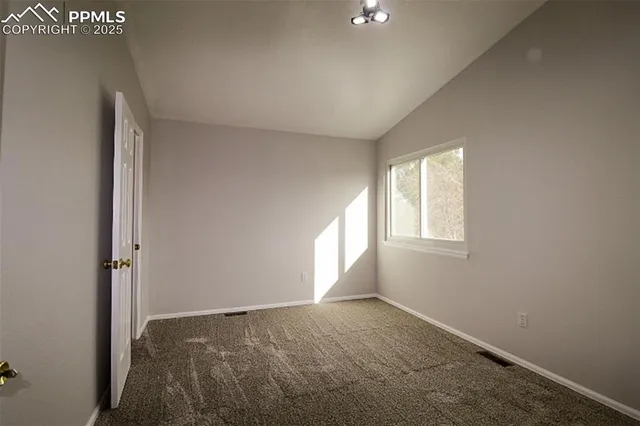 a view of an empty room and window
