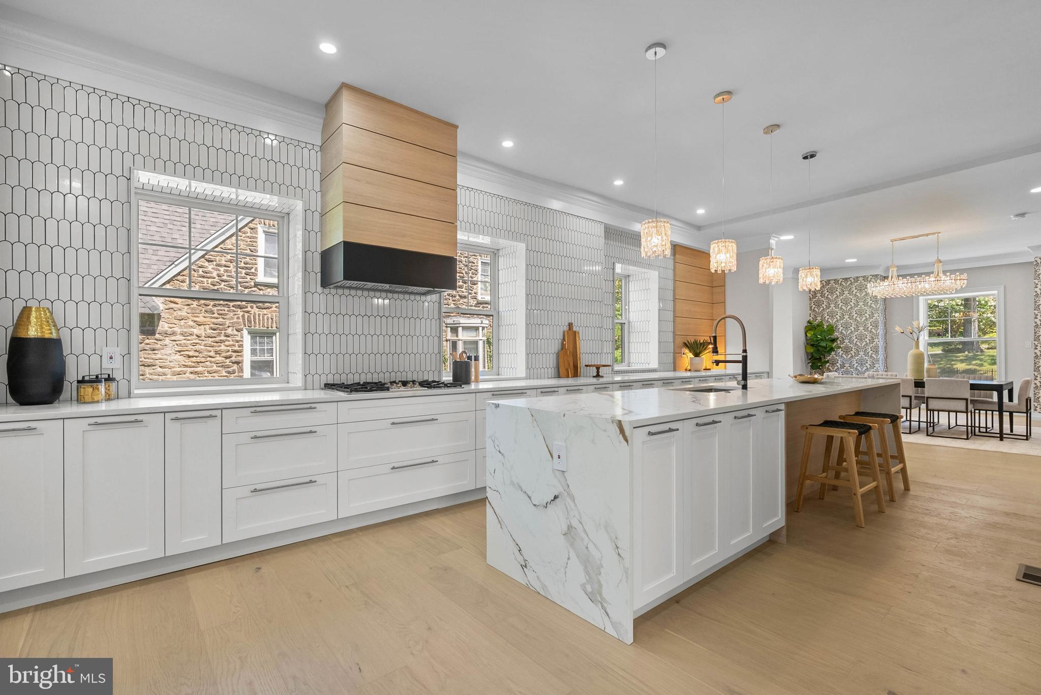 319 Pelham Road Philadelphia, PA 19119 - Photo 1 of 40 a kitchen with counter top space sink and center island
